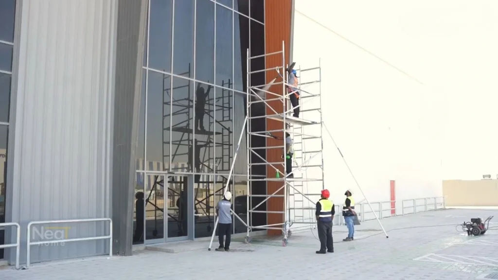 professional cleaners cleaning the facade glass in islamabad